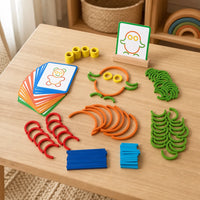 Shape Building Puzzle with Sticks & Rings set out on a real table at home