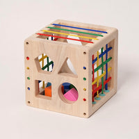 Wooden shape sorting cube with coloured sliding bars and shape holes