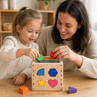 Child playing with the Shape Sorting Cube Wooden Montessori Toy