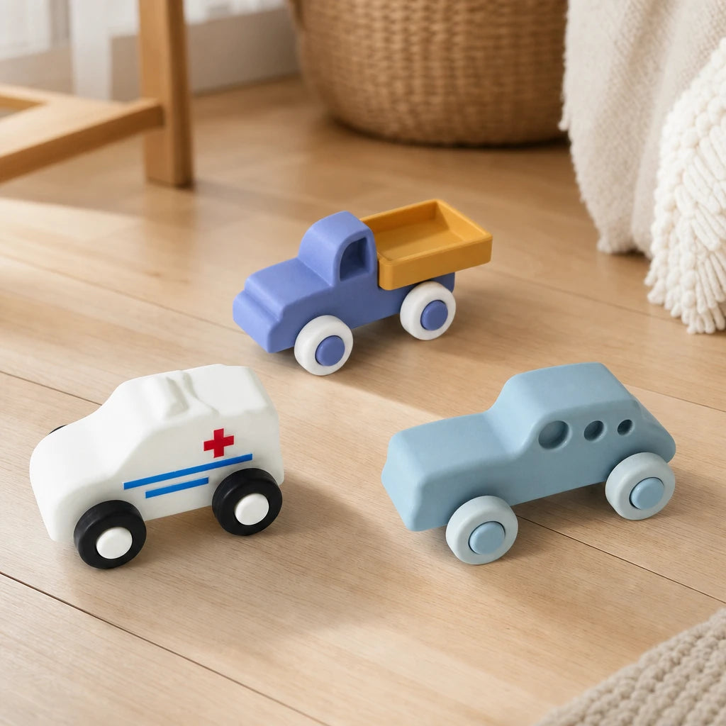 Soft Toy Cars 3-Piece Set for Toddlers set out on a real table at home