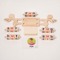 Spelling blocks robots holding letter cubes beside a word card