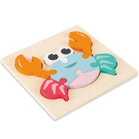 Layered wooden crab puzzle on a plywood board