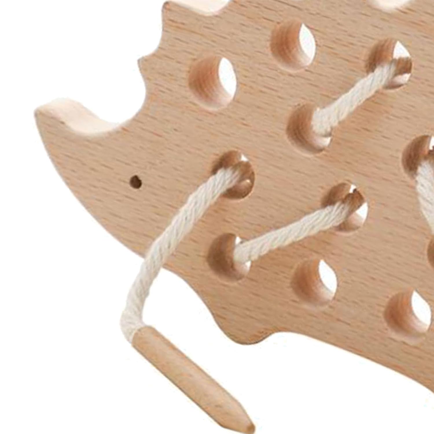 Close-up of the cord threaded through the hedgehog lacing board