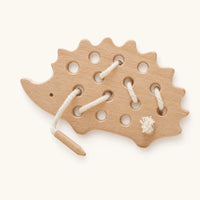 Toddler Lacing Toy Hedgehog Wooden shown complete on a plain background