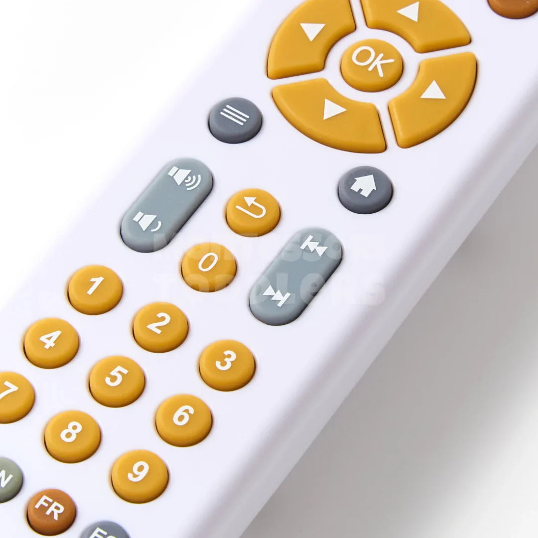 Toy remote control with large yellow and grey buttons