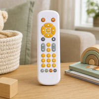 Toddler Learning Remote Control with Lights & Sounds set out on a real table at home