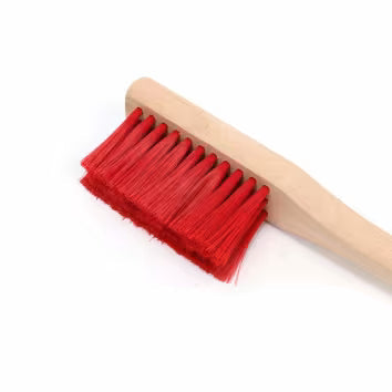 Wooden dustpan brush with red bristles
