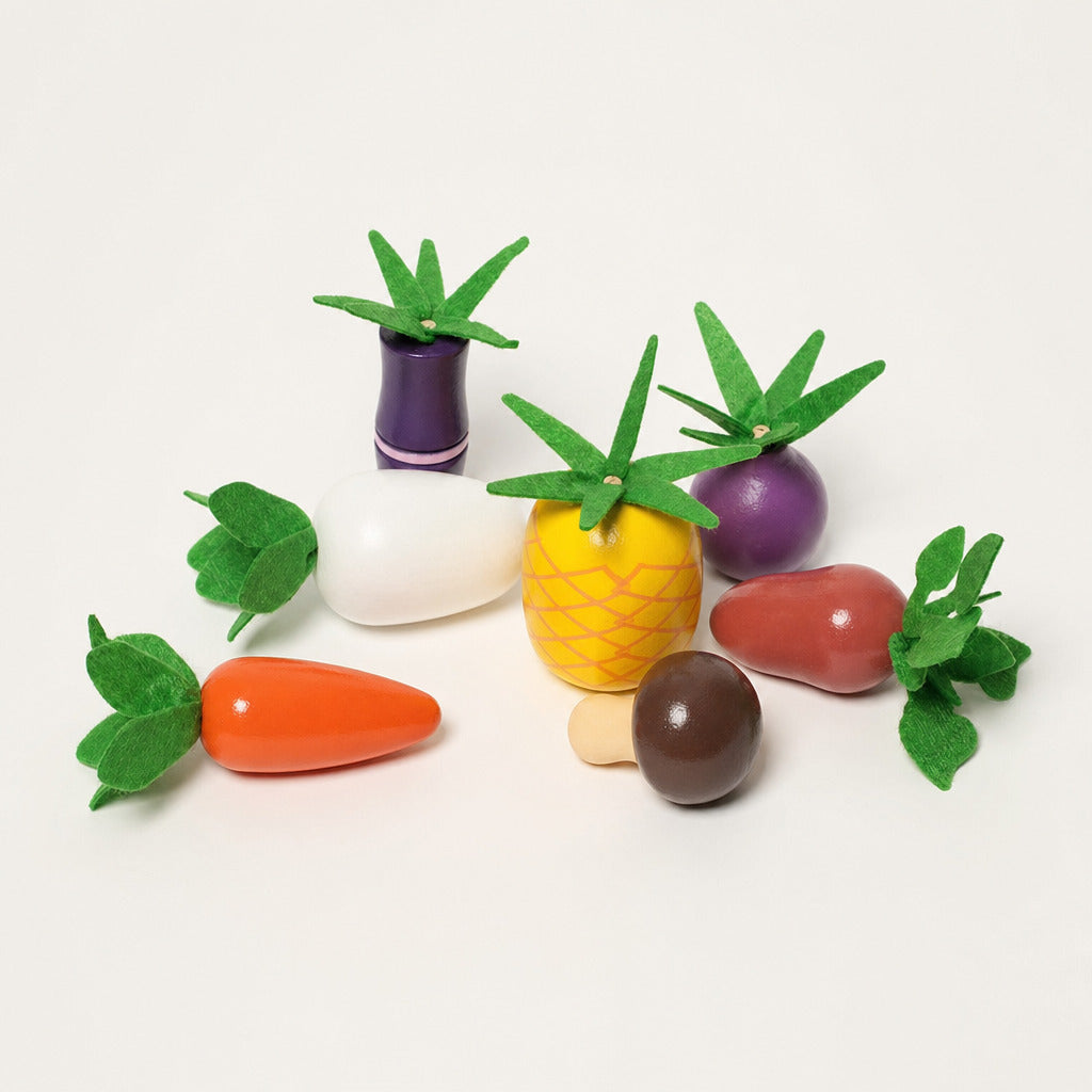 The wooden garden vegetables laid out beside the sorter