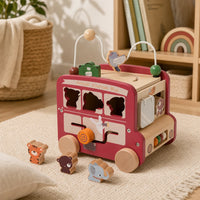 Wooden Activity Bus Safari Theme Montessori Toy set out on a real table at home