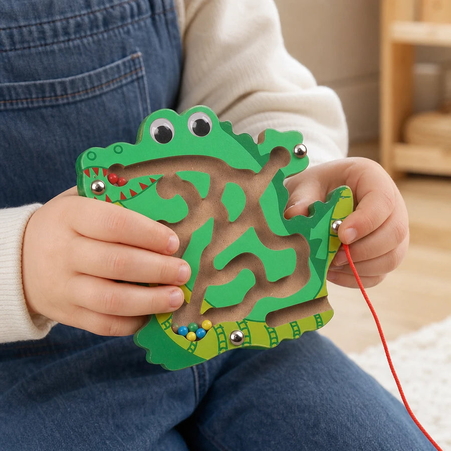 Close-up of a child's hands using the Wooden Animal Maze Crocodile Design