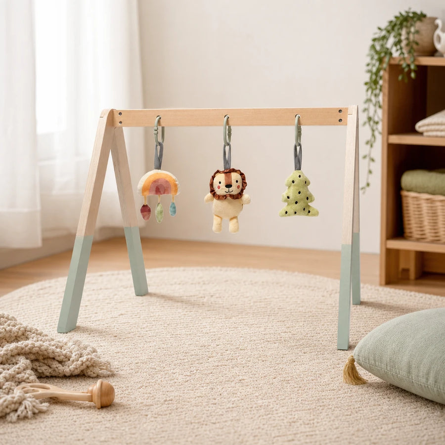 Wooden Baby Gym with Natural Arch & Hanging Toys shown on a real table surface