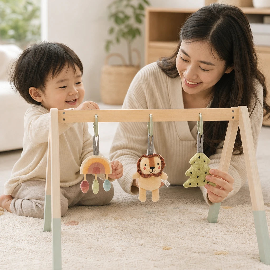 Child using the Wooden Baby Gym with Natural Arch & Hanging Toys
