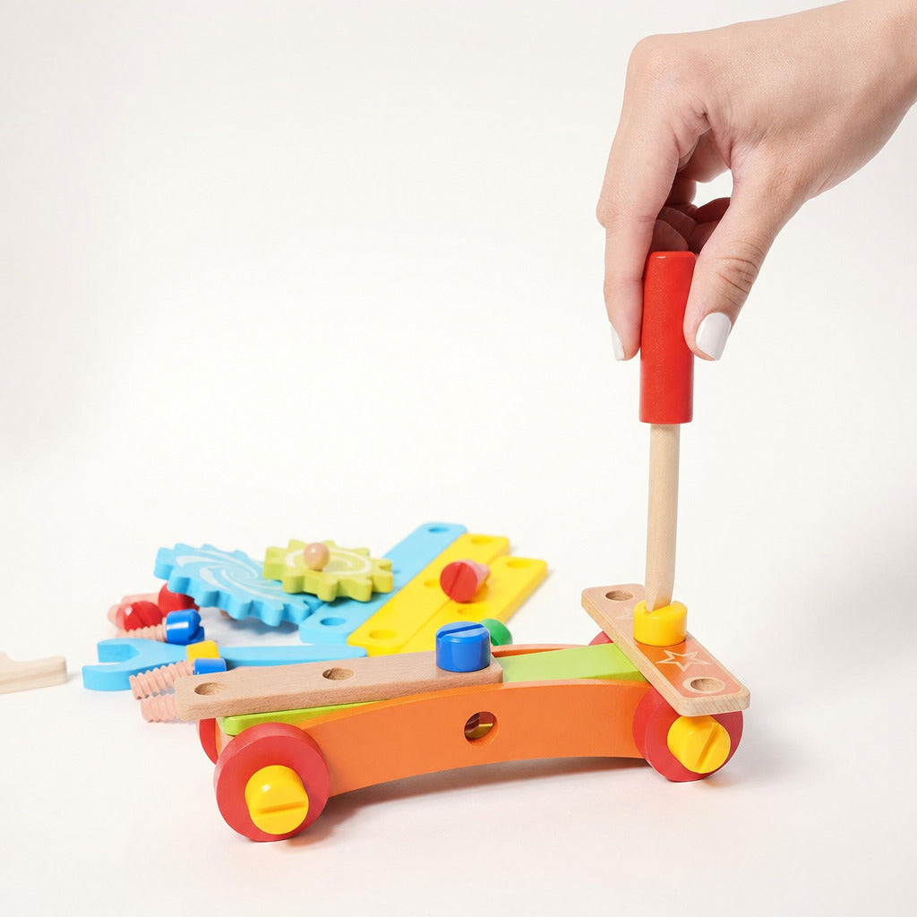 Child using the toy screwdriver on the wooden construction set