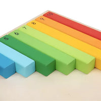 Rainbow counting sticks arranged as a staircase on the number board