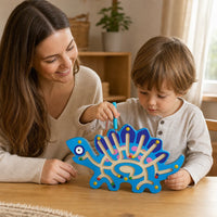 Small hands guiding beads along the wooden dinosaur maze