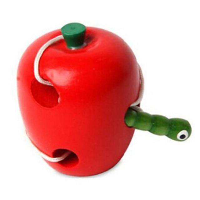 Red wooden apple lacing toy with cord and worm-shaped needle