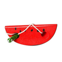 Watermelon slice lacing toy with cord and worm-shaped needle