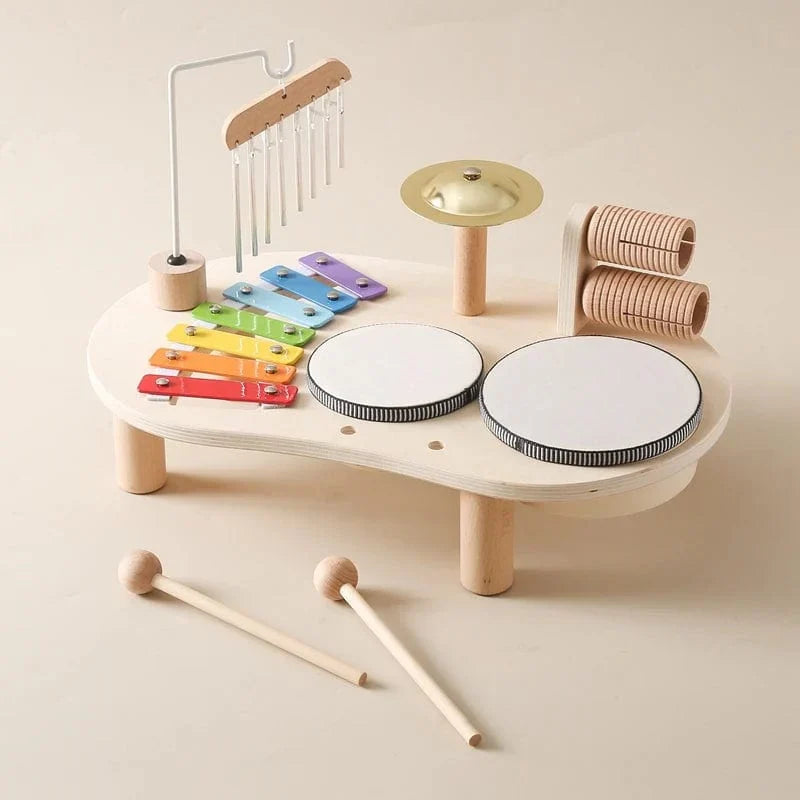 Wooden music station with xylophone, drums and chimes on legs