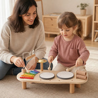 Child playing with the Wooden Music Station – 6 Instruments Set