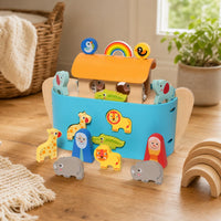 Wooden Noah's Ark with Animals & Storybook shown on a real table surface