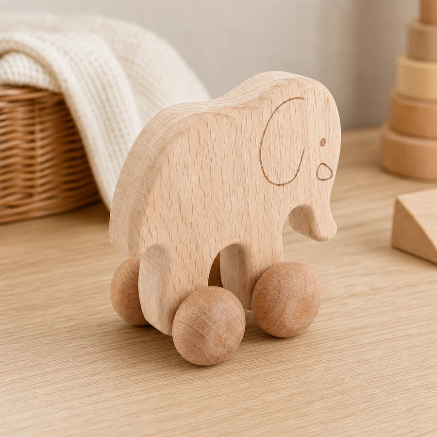 Wooden Push Toy Elephant on Wheels set out on a real table at home