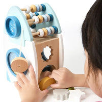 Child playing with the rocket activity centre's abacus and dials