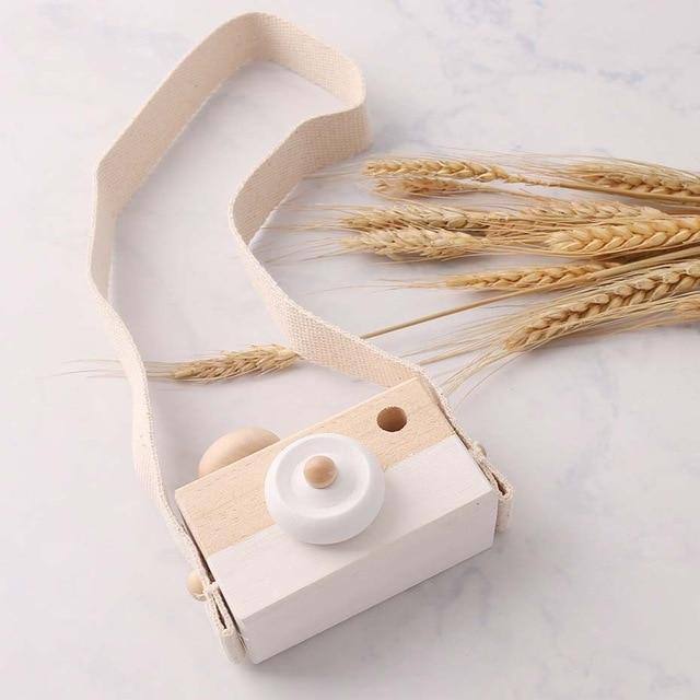 Wooden toy camera in cream with a cotton neck strap