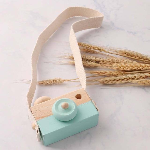 Wooden toy camera in mint with a cotton neck strap