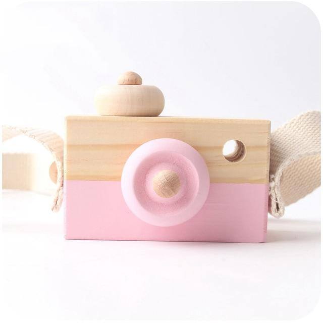 Wooden toy camera in pink with a cotton neck strap