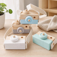 Wooden Toy Camera with Strap for Pretend Play set out on a real table at home